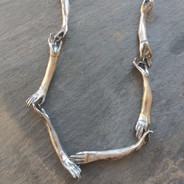 Long Silver Connecting Hands Necklace